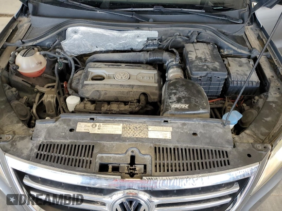 2011 Volkswagen Tiguan SEL z VIN WVGBV7AXXBW559663, wystawiony jako Copart lot #52307905 z przebiegiem 125 263 mil mil oraz Szkoda całkowita • Salvage title. Historia ofert i sprzedaży dostępna na DreamBid. Obrazek 11.
