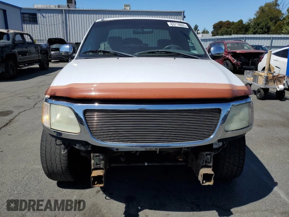 2002 Ford F-150 XL with VIN 1FTRX17212NA28461, listed as a Copart auction lot 63710665 with 185,460 mi miles and Salvage title. Bid and sale history available at DreamBid. Image 5.
