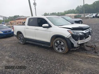 2018 Honda Ridgeline RTL-E with VIN 5FPYK3F77JB017293, listed as a IAAI auction lot 42422614 with 87,700 mi miles and . Bid and sale history available at DreamBid. Image 1.