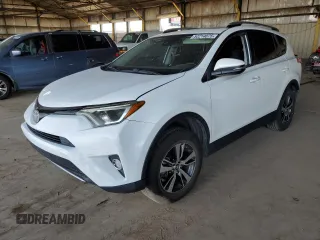 2018 Toyota RAV4 XLE with VIN JTMWFREV2JJ740145, listed as a Copart auction lot 52214075 with 129,940 mi miles and Salvage title. Bid and sale history available at DreamBid. Image 1.