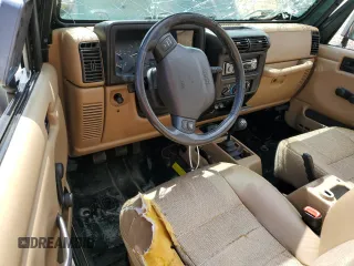 1999 Jeep Wrangler Sport with VIN 1J4FY19S0XP402688, listed as a Copart auction lot 58968125 with 211,910 mi miles and Salvage title. Bid and sale history available at DreamBid. Image 8.
