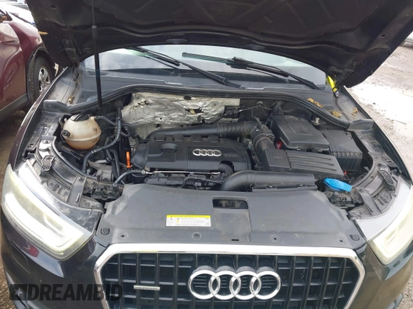 2015 Audi Q3 Premium Plus z VIN WA1EFCFS6FR001473, wystawiony jako IAAI lot #42795951 z przebiegiem 148 638 mil mil oraz . Historia ofert i sprzedaży dostępna na DreamBid. Obrazek 10.