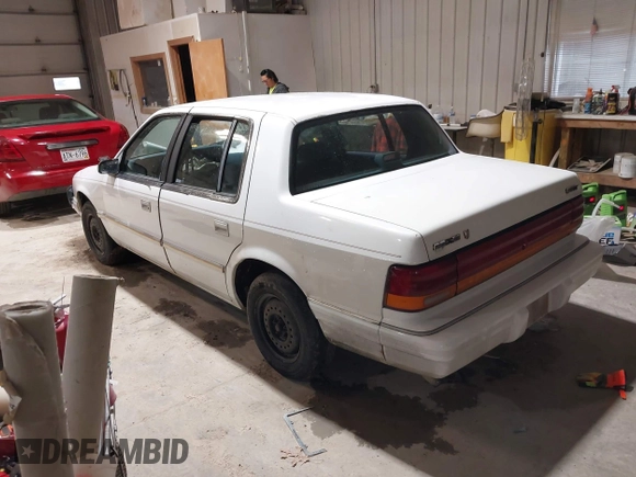 1994 Dodge Spirit z VIN 3B3AA46KXRT214299, wystawiony jako IAAI lot #41908262 z przebiegiem 72 619 mil mil oraz . Historia ofert i sprzedaży dostępna na DreamBid. Obrazek 3.