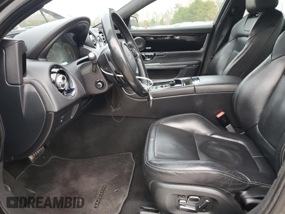 2015 Jaguar XJ with VIN SAJWA1CZ1F8V85402, listed as a Copart auction lot 86717734 with 201,249 mi miles and Salvage Title. Bid and sale history available at carsss.com. Image 7.