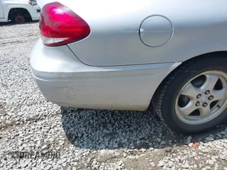 2006 Ford Taurus SE z VIN 1FAFP53UX6A105350, wystawiony jako IAAI lot #42363631 z przebiegiem 107 825 mil mil oraz . Historia ofert i sprzedaży dostępna na DreamBid. Obrazek 12.