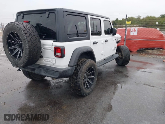 2019 Jeep Wrangler Unlimited Sport Altitude with VIN 1C4HJXDG3KW528647, listed as a IAAI auction lot 40986538 with 85,381 mi miles and . Bid and sale history available at DreamBid. Image 4.