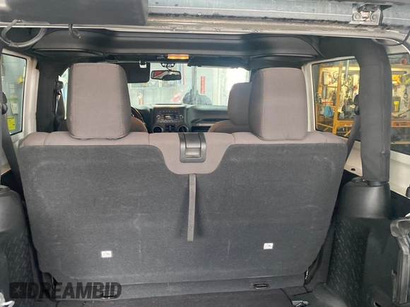 2017 Jeep Wrangler Willys Wheeler with VIN 1C4AJWAGXHL602088, listed as a Copart auction lot 45524745 with 101,847 mi miles and Clean Title. Bid and sale history available at DreamBid. Image 6.