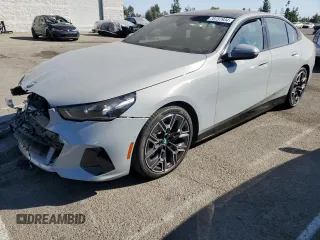 2024 BMW i5 eDrive40 with VIN WBY33FK01RCN99702, listed as a Copart auction lot 78737934 with 11,889 mi miles and Salvage Title. Bid and sale history available at carsss.com. Image 1.