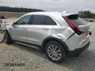 2021 Cadillac XT4 FWD Premium Luxury z VIN 1GYFZCR40MF000293, wystawiony jako Copart lot #58710565 z przebiegiem 49 721 mil mil oraz Szkody całkowita. Historia ofert i sprzedaży dostępna na DreamBid. Obrazek 2.