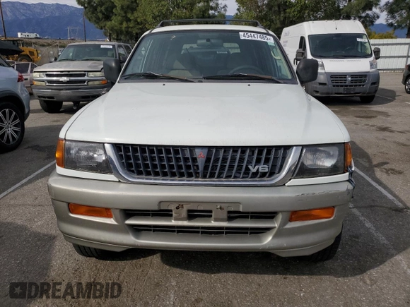 1999 Mitsubishi Montero LS z VIN JA4LS31H2XP037110, wystawiony jako Copart lot #45447485 z przebiegiem 166 942 mil mil oraz Szkoda całkowita • Salvage title. Historia ofert i sprzedaży dostępna na DreamBid. Obrazek 5.