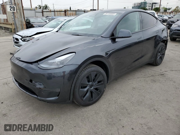 2025 Tesla Model Y Long Range with VIN 7SAYGDED4SF242721, listed as a Copart auction lot 56159955 with 7,131 mi miles and Salvage Title. Bid and sale history available at DreamBid. Image 1.