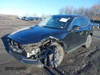 2021 Mazda CX-5 Touring with VIN JM3KFBCM2M1303063, listed as a IAAI auction lot 41814604 with 36,116 mi miles. Bid and sale history available at carsss.com. Image 2.
