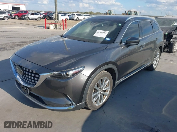 2016 Mazda CX-9 Grand Touring with VIN JM3TCADY8G0114940, listed as a IAAI auction lot 40701187 with 112,311 mi miles and . Bid and sale history available at DreamBid. Image 2.