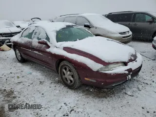 1999 Oldsmobile Aurora with VIN 1G3GR62C8X4113745, listed as a Copart auction lot 60573923 with 177,809 mi miles and Salvage Title. Bid and sale history available at DreamBid. Image 4.