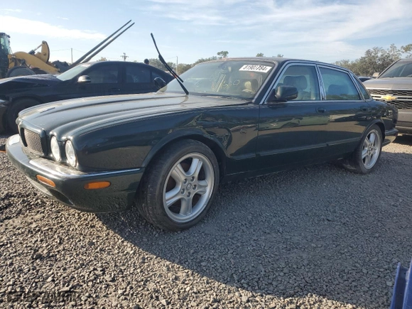2003 Jaguar XJ with VIN SAJDA12C63LF56705, listed as a Copart auction lot 81903784 with 0 mi miles and Salvage Title. Bid and sale history available at carsss.com. Image 1.