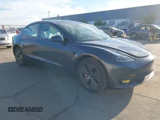 2022 Tesla Model 3 Long Range with VIN 5YJ3E1EB4NF293635, listed as a IAAI auction lot 41388234 with 28,396 mi miles. Bid and sale history available at carsss.com. Image 1.