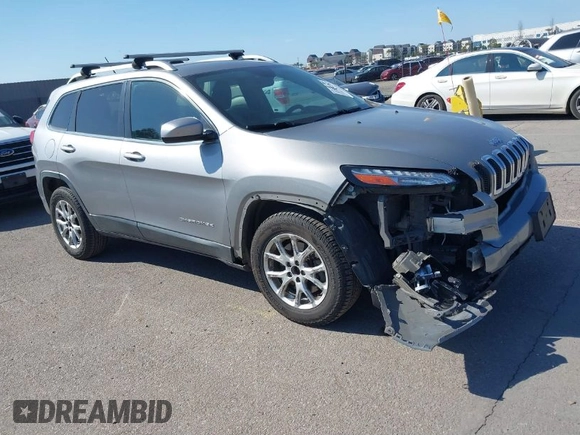 2015 Jeep Cherokee Latitude z VIN 1C4PJMCB0FW749323, wystawiony jako IAAI lot #41852102 z przebiegiem 162 060 mil mil oraz . Historia ofert i sprzedaży dostępna na DreamBid. Obrazek 1.
