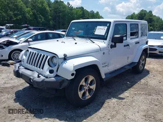 2018 Jeep Wrangler Unlimited Sahara with VIN 1C4BJWEG3JL805263, listed as a IAAI auction lot 42593276 with 96,489 mi miles and . Bid and sale history available at DreamBid. Image 17.