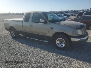 1999 Ford F-150 with VIN 1FTRX17W9XNB77873, listed as a Copart auction lot 52851065 with Not provided miles and Salvage title. Bid and sale history available at DreamBid. Image 4.