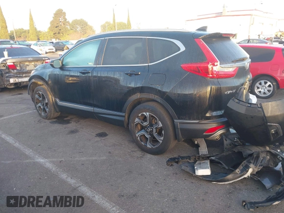 2019 Honda CR-V Touring with VIN 7FARW2H9XKE012394, listed as a IAAI auction lot 41092564 with 49,527 mi miles and . Bid and sale history available at DreamBid. Image 3.