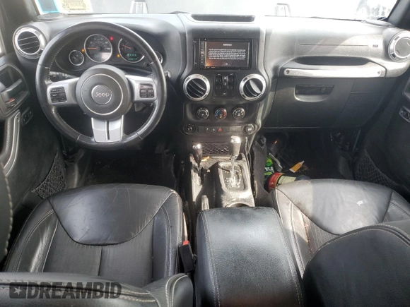 2015 Jeep Wrangler Unlimited Freedom with VIN 1C4BJWDG4FL568601, listed as a Copart auction lot 64041415 with 128,874 mi miles and Salvage title. Bid and sale history available at DreamBid. Image 8.
