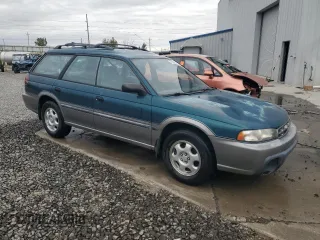 1996 Subaru Legacy Outback with VIN 4S3BG685XT7984194, listed as a Copart auction lot 77999224 with 130,804 mi miles and Salvage title. Bid and sale history available at DreamBid. Image 4.