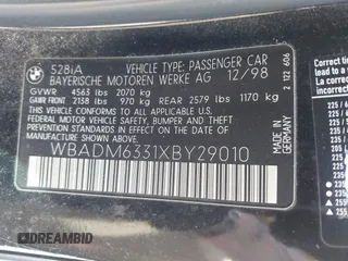1999 BMW 5 Series 528iA with VIN WBADM6331XBY29010, listed as a IAAI auction lot 42103420 with 196,575 mi miles. Bid and sale history available at carsss.com. Image 9.