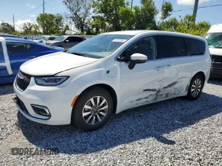 2023 Chrysler Pacifica Hybrid Touring L z VIN 2C4RC1L74PR558768, wystawiony jako Copart lot #61407555 z przebiegiem 70 387 mil mil oraz Czysty tytuł • Clean title. Historia ofert i sprzedaży dostępna na DreamBid. Obrazek 1.