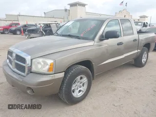 2006 Dodge Dakota SLT with VIN 1D7HE48N16S703072, listed as a IAAI auction lot 42156709 with 102,919 mi miles. Bid and sale history available at carsss.com. Image 2.