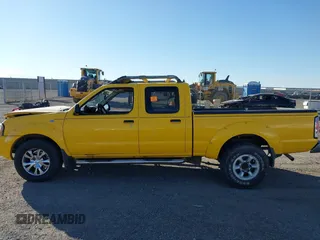 2003 Nissan Frontier SE z VIN 1N6ED29X13C458619, wystawiony jako IAAI lot #41370222 z przebiegiem 121 006 mil mil oraz . Historia ofert i sprzedaży dostępna na DreamBid. Obrazek 14.