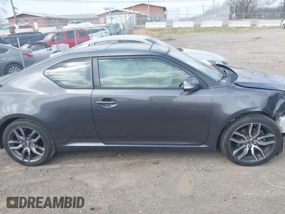 2015 Scion tC z VIN JTKJF5C70FJ013710, wystawiony jako IAAI lot #41770647 z przebiegiem Nie podano mil oraz . Historia ofert i sprzedaży dostępna na DreamBid. Obrazek 13.