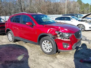 2016 Mazda CX-5 Touring with VIN JM3KE2CY5G0842812, listed as a IAAI auction lot 41595530 with 148,028 mi miles and . Bid and sale history available at carsss.com. Image 1.