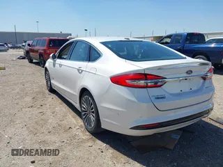 2017 Ford Fusion Titanium with VIN 3FA6P0SUXHR147336, listed as a IAAI auction lot 41873106 with 103,247 mi miles and . Bid and sale history available at DreamBid. Image 3.