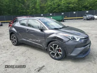 2018 Toyota C-HR XLE z VIN JTNKHMBX2J1003394, wystawiony jako Copart lot #58234865 z przebiegiem 132 574 mil mil oraz Szkoda całkowita • Salvage title. Historia ofert i sprzedaży dostępna na DreamBid. Obrazek 4.