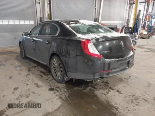 2014 Lincoln MKS with VIN 1LNHL9DK8EG609955, listed as a IAAI auction lot 41580770 with 109,864 mi miles. Bid and sale history available at carsss.com. Image 3.