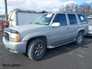 1999 GMC Denali with VIN 1GKEK13R7XR903255, listed as a IAAI auction lot 41496032 with 233,645 mi miles. Bid and sale history available at carsss.com. Image 2.