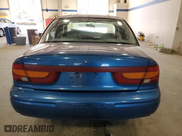 2001 Saturn SL z VIN 1G8ZK52791Z210421, wystawiony jako Copart lot #48808595 z przebiegiem 98 960 mil mil oraz Szkoda całkowita • Salvage title. Historia ofert i sprzedaży dostępna na DreamBid. Obrazek 6.