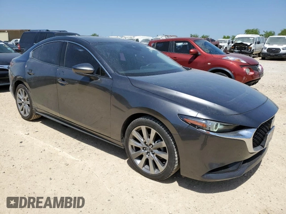 2021 Mazda 3 Premium with VIN JM1BPADL9M1319945, listed as a Copart auction lot 52902425 with 74,221 mi miles and Salvage title. Bid and sale history available at DreamBid. Image 4.