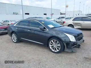 2013 Cadillac XTS Luxury with VIN 2G61P5S34D9103182, listed as a IAAI auction lot 40184614 with 183,014 mi miles. Bid and sale history available at carsss.com. Image 1.