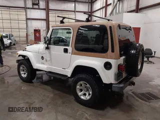 1997 Jeep Wrangler Sahara with VIN 1J4FY49S3VP529837, listed as a IAAI auction lot 41752978 with 138,024 mi miles. Bid and sale history available at carsss.com. Image 3.