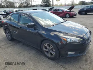 2018 Ford Focus SE with VIN 1FADP3FEXJL215912, listed as a Copart auction lot 50518385 with 100,080 mi miles and Salvage Title. Bid and sale history available at carsss.com. Image 4.