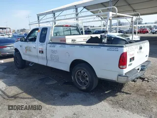 2002 Ford F-150 XL with VIN 1FTRX17L82NA54581, listed as a IAAI auction lot 41698662 with 220,321 mi miles. Bid and sale history available at carsss.com. Image 3.