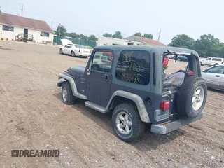 2001 Jeep Wrangler Sport with VIN 1J4FA49S91P330175, listed as a IAAI auction lot 40133432 with 999,999 mi miles. Bid and sale history available at carsss.com. Image 3.