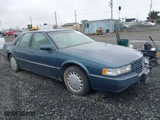 1993 Cadillac Seville Touring STS with VIN 1G6KY5290PU821230, listed as a IAAI auction lot 41778659 with 197,001 mi miles. Bid and sale history available at carsss.com. Image 1.