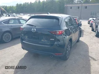 2018 Mazda CX-5 Touring z VIN JM3KFBCM9J0358997, wystawiony jako IAAI lot #42332606 z przebiegiem 93 952 mil mil oraz . Historia ofert i sprzedaży dostępna na DreamBid. Obrazek 4.