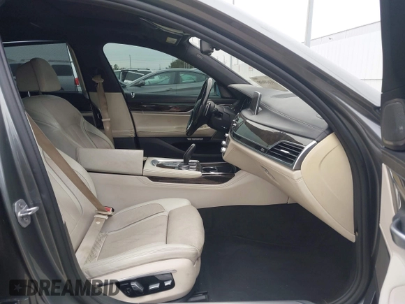 2016 BMW 7 Series 740i with VIN WBA7E2C56GG546920, listed as a IAAI auction lot 41610698 with 119,689 mi miles. Bid and sale history available at carsss.com. Image 5.