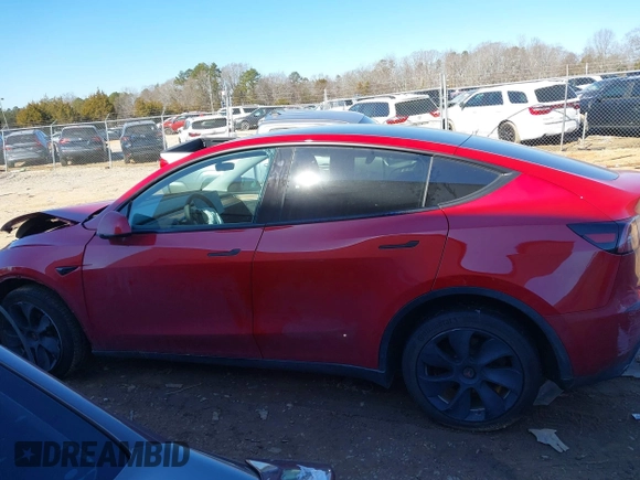 2023 Tesla Model Y Long Range with VIN 7SAYGDEE8PF709459, listed as a IAAI auction lot 41334108 with 51,544 mi miles. Bid and sale history available at carsss.com. Image 13.