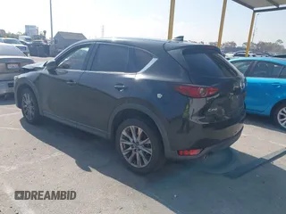 2019 Mazda CX-5 Grand Touring with VIN JM3KFADMXK1547727, listed as a IAAI auction lot 42138071 with Not provided miles and . Bid and sale history available at DreamBid. Image 3.