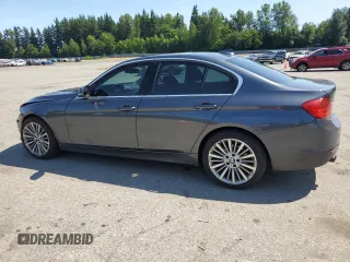 2015 BMW 3 Series 328i xDrive with VIN WBA3B3C5XFJ985147, listed as a Copart auction lot 59819905 with 113,492 mi miles and Salvage title. Bid and sale history available at DreamBid. Image 2.