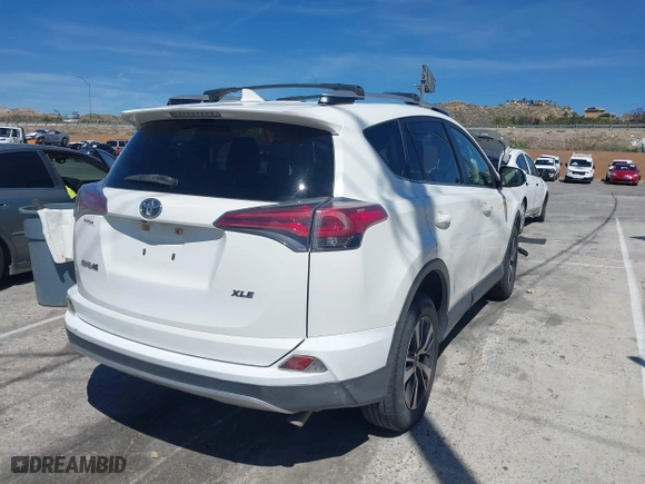 2016 Toyota RAV4 XLE with VIN JTMWFREV5GJ098870, listed as a IAAI auction lot 41878605 with 109,996 mi miles. Bid and sale history available at carsss.com. Image 4.